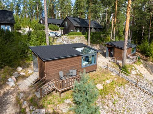 an aerial view of a cabin in the woods at Koskisviitti 4 - Private High Quality Suite with Lake Views in Laukaa