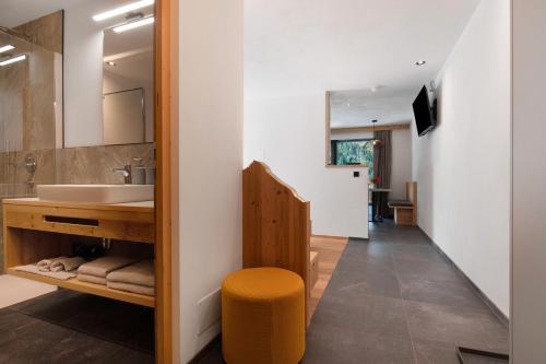 a bathroom with a sink and a mirror at Mountain Chalet Tribulaun Pflersch in Colle Isarco
