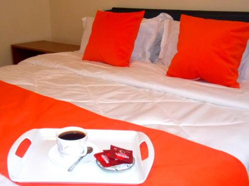 Postel nebo postele na pokoji v ubytování Cozy Corner Ensuite Near SGR &JKIA, Syokimau