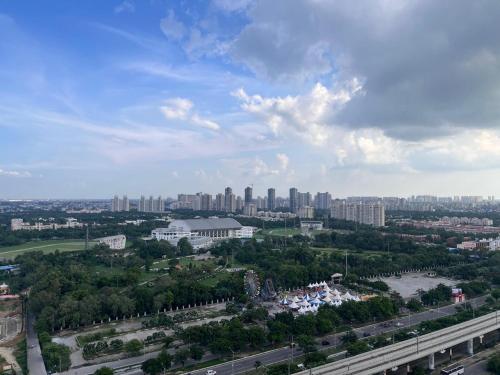 an aerial view of a city with tall buildings at Serene View Apartment in Greater Noida