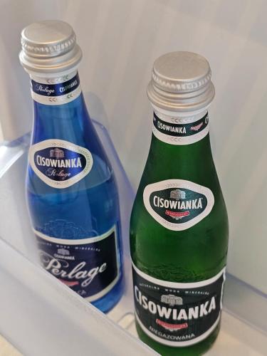 two bottles of beer sitting in a refrigerator at Sileo Apart No.85 in Ustka