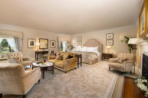 a bedroom with a bed and a living room at Grantley Hall in Ripon
