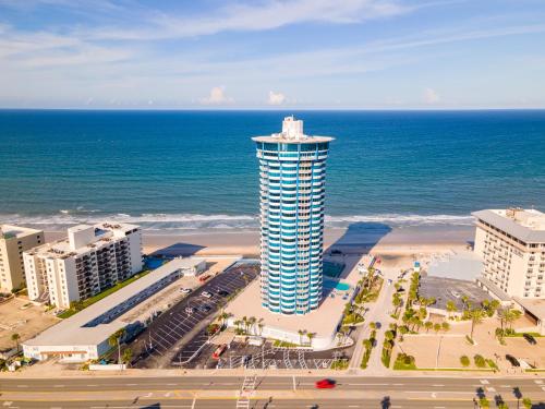a building on the beach next to the ocean at On the Beach-2/Br 2/Bath, 26th floor! Spectacular views of Ocean & River in Daytona Beach Shores