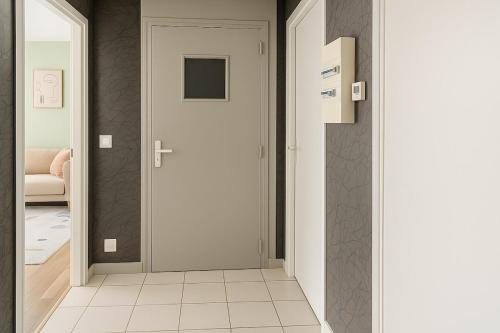 Postel nebo postele na pokoji v ubytování Le Monlahaye, cozy & bright