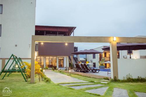 a view of a house with a playground at AIDEN HOMES AND APARTMENTS HOTEl in Koforidua