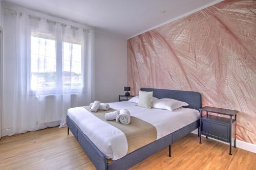 Giường trong phòng chung tại Villa Manava - Climatisée avec terrasse et jardin