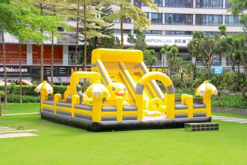 a playground in a park in front of a building at Crowne Plaza Guangzhou Huadu by IHG - Free Shuttle bus between hotel to Exhibition Center During Canton Fair in Guangzhou