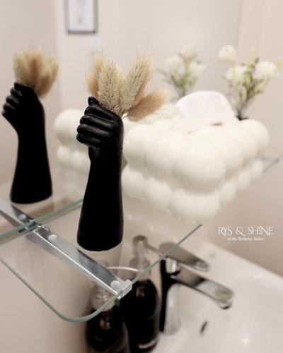 two black gloves sitting on top of a sink at RYS & Shine in Silang