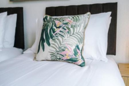 a pillow sitting on top of a bed at 2 Bed apartment, sleeps up to 5 in Blackpool