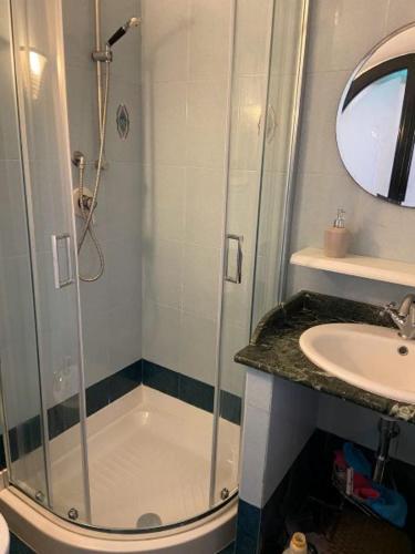 a bathroom with a shower and a sink at Appartamento Porticciolo in Piombino