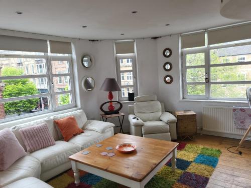 a living room with a couch and a coffee table at Lovely 2 bed flat in the VERY CENTRE of Newcastle in Newcastle upon Tyne