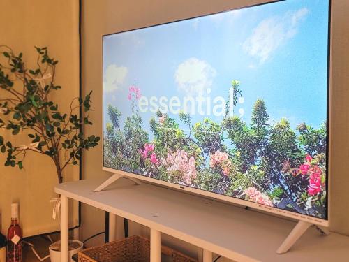 a large screen television sitting on a table at NEW #신정네거리역 5분 #독채 #짐보관 #홍대입구 #명동 # Sinjeong negeori Stn in Seoul