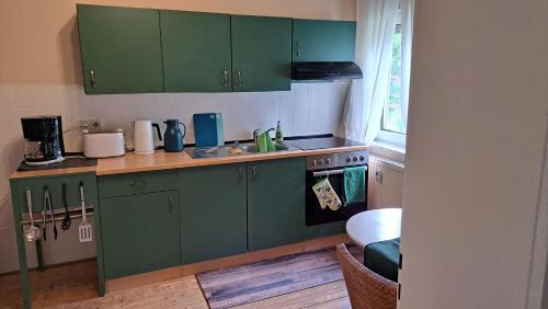 Una cocina o zona de cocina en Ferienwohnung Das Fuchsrevier