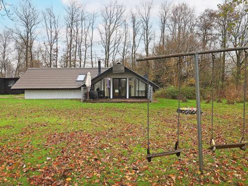 a small house in the middle of a yard at 6 person holiday home in Roslev-By Traum in Vester Grønning
