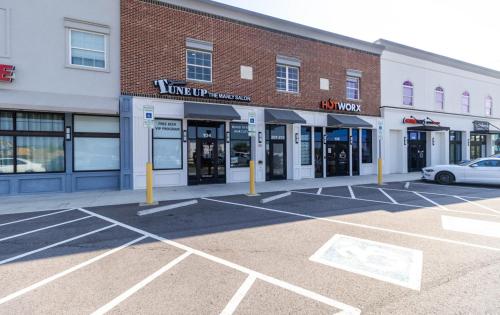 an empty parking lot in front of a store at SpringBrook Lofts in Alcoa