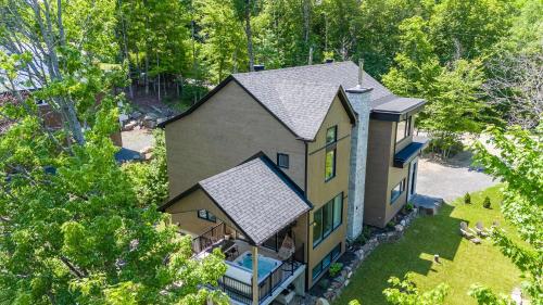 an aerial view of a house with at Spa Pool table Lake access - Le 515 Beaulac in Chertsey