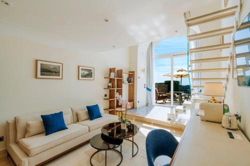 a living room with a couch and a table at San Montano Resort & Spa in Ischia