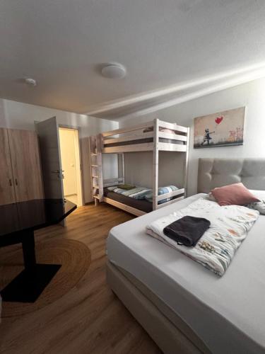 a bedroom with a bed and a television in it at Aby in Rosenheim