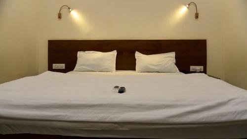 Ένα ή περισσότερα κρεβάτια σε δωμάτιο στο Hotel 36 Westinn Vikaspuri