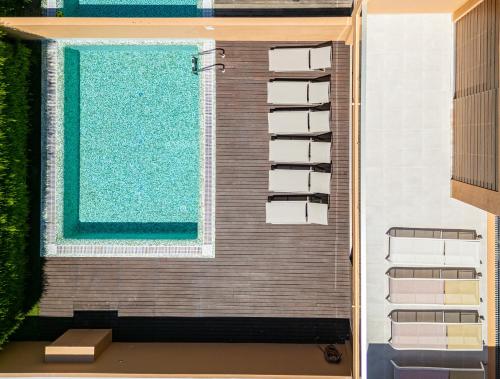 a building with a swimming pool next to a window at Sun Salgados and Golf By Dreamplaces in Galé