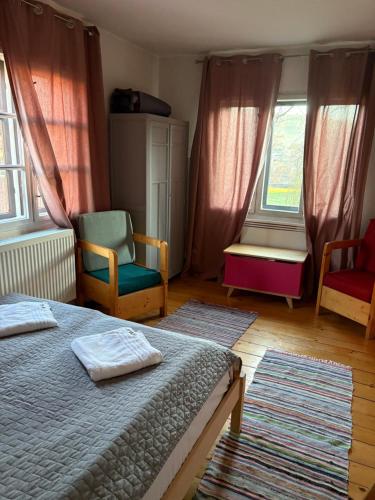 Ένα ή περισσότερα κρεβάτια σε δωμάτιο στο Casa Bucataria Fonix