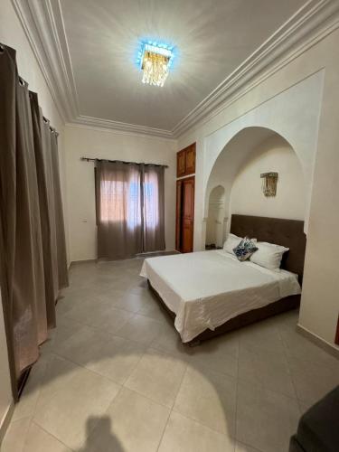 Ένα ή περισσότερα κρεβάτια σε δωμάτιο στο Villa Benben