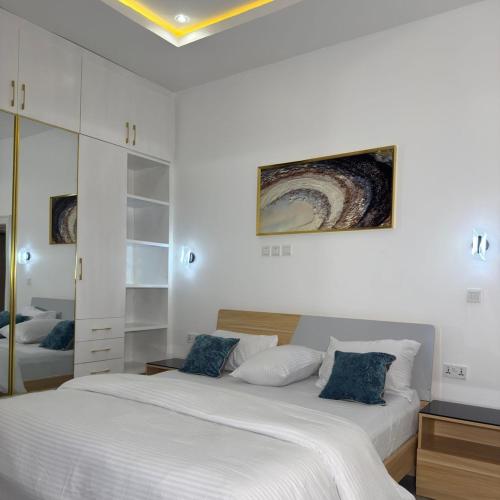 Postel nebo postele na pokoji v ubytování Precious Pavilion Apartment