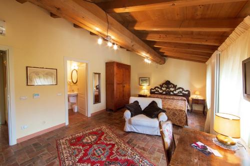 a bedroom with a bed in a room with wooden ceilings at Agriturismo Delo in Verona