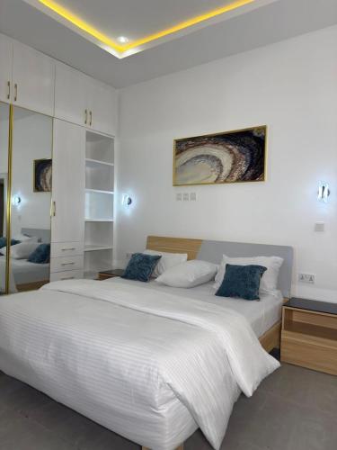 Postel nebo postele na pokoji v ubytování Precious Pavilion Apartment