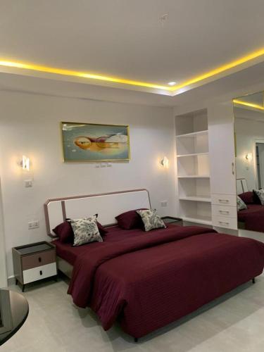 Postel nebo postele na pokoji v ubytování Precious Pavilion Apartment