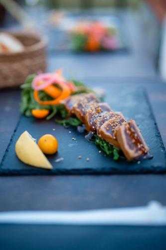 a plate of food with meat and vegetables on a table at Le 10 18 hôtel restaurant in Sainte-Croix-de-Verdon