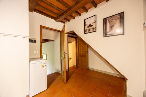 a hallway with a staircase in a house at La Casetta di Ghiora in Falciano