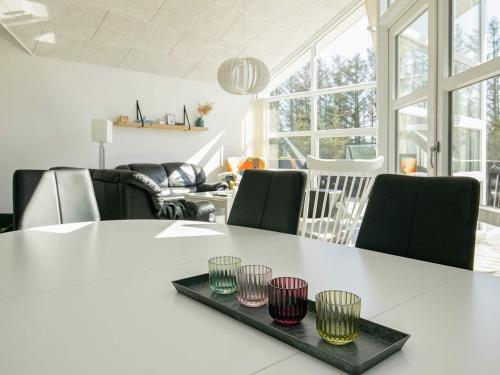 a living room with a white table and chairs at Luxury Spa Retreat in Lokken - By Traum Ferienwohnungen in Løkken