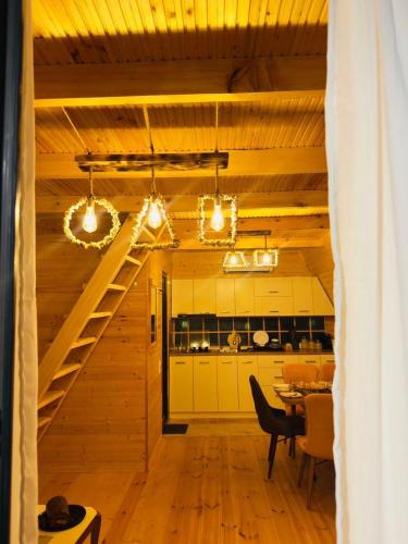 a kitchen and dining room with a staircase in a house at Rakushki's house 2 in K'obulet'i