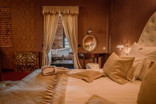 Postel nebo postele na pokoji v ubytování Hotel Zamek Gniew