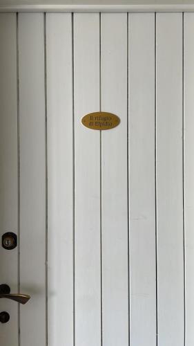 a surfboard hanging on a wall at Il rifugio di Elpidio in SantʼElpidio a Mare