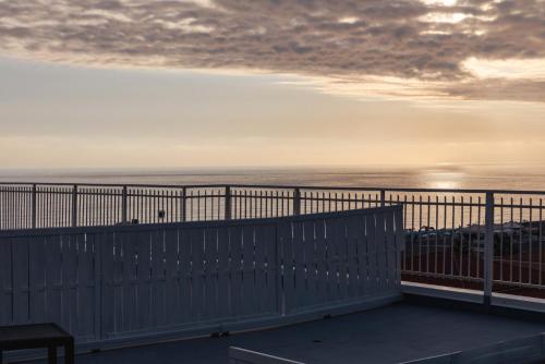 a view of the ocean from a balcony at La Terrazza sul Mare in Praia a Mare