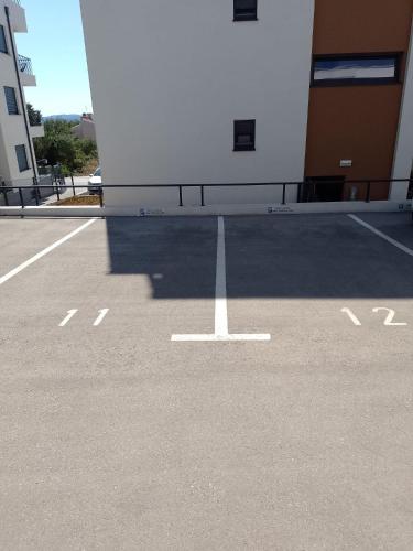 a parking lot with a white pole in a building at Luxury Penthouse ARIA in Zadar