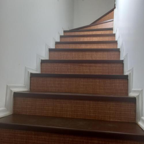 a set of stairs in a building at Pousada Parque Suites - Estacionamento e Piscina in Guarujá