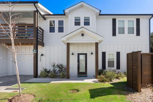 a white house with black accents at BCW32A - Sea Escape in Corolla