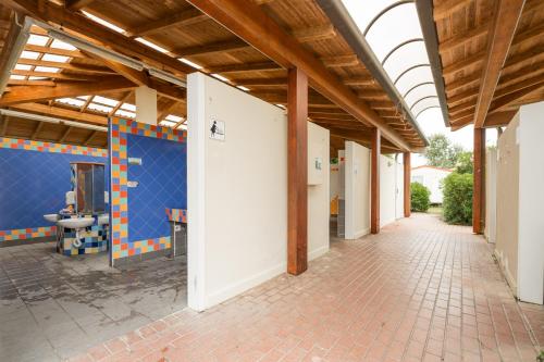 an empty hallway of a building with a toilet at Club del Sole Vigna sul Mar Family Collection in Lido di Pomposa