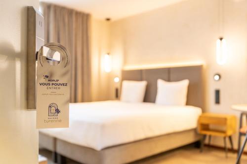 Letto o letti in una camera di Hôtel Maison Turenne