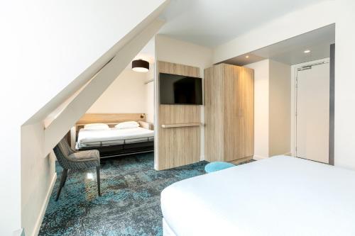 Letto o letti in una camera di Hôtel Maison Turenne