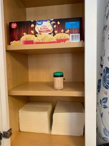 a cupboard with a shelf with some food on it at Rhinestone Cowboy in Hurricane
