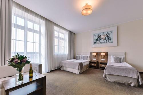 Postel nebo postele na pokoji v ubytování Hotel Zamek Gniew