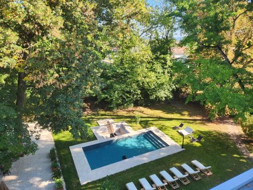 an overhead view of a swimming pool in a yard at Château de la Rochetière in Marcilloles