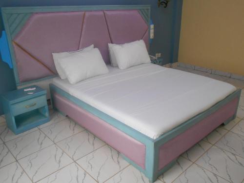 Postel nebo postele na pokoji v ubytování Inno Group Hotel