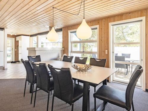 a dining room with a table and chairs at Renovated Retreat near Beach - By Traum Ferienwohnungen in Blåvand