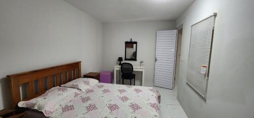 En eller flere senge i et værelse på Duplex novo e mobiliado em Vilas