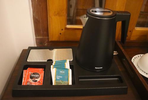 a coffee maker sitting on top of a counter at The Spice House Mirissa in Mirissa